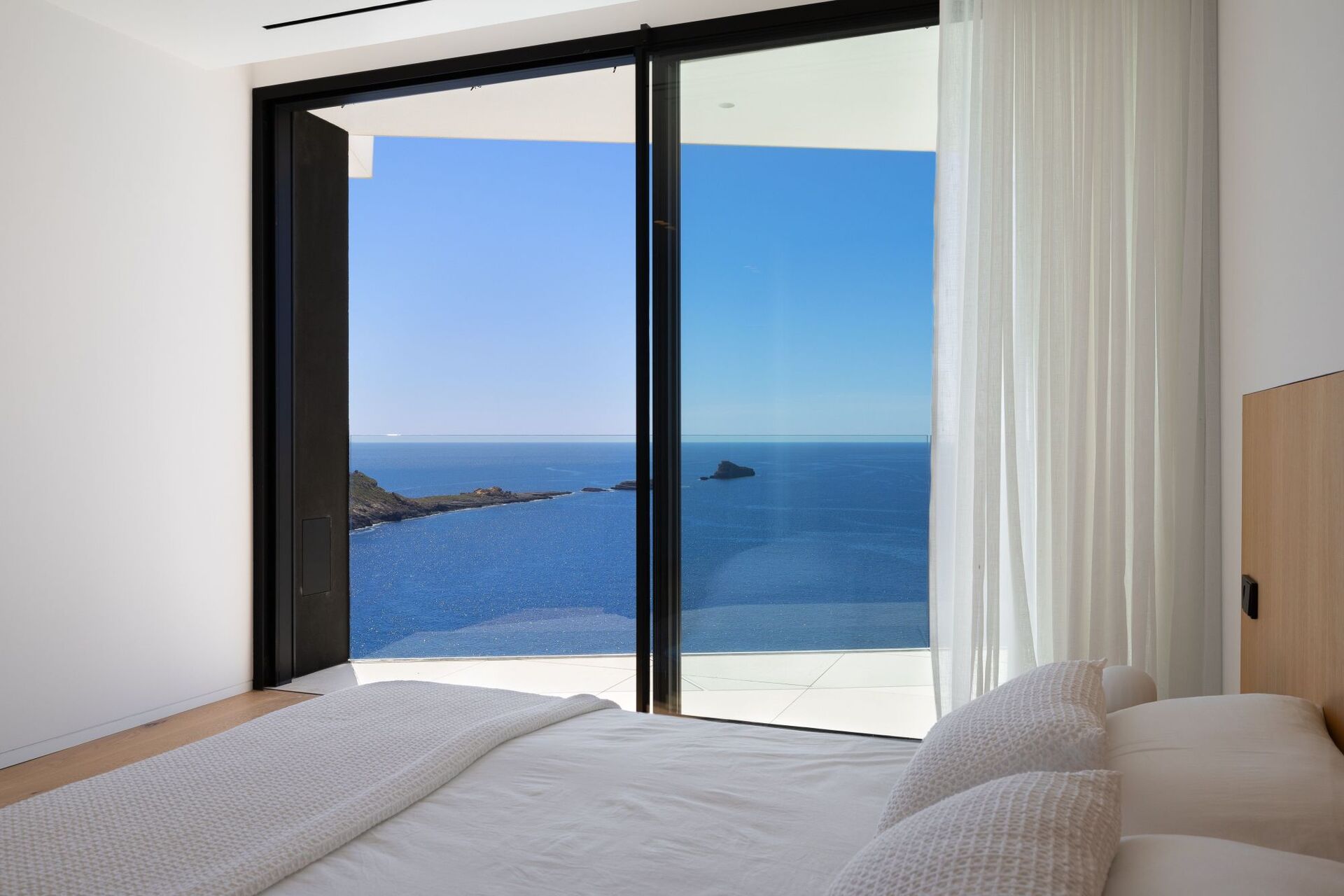 Swimming pool and waterfront view from the frontline designer villa