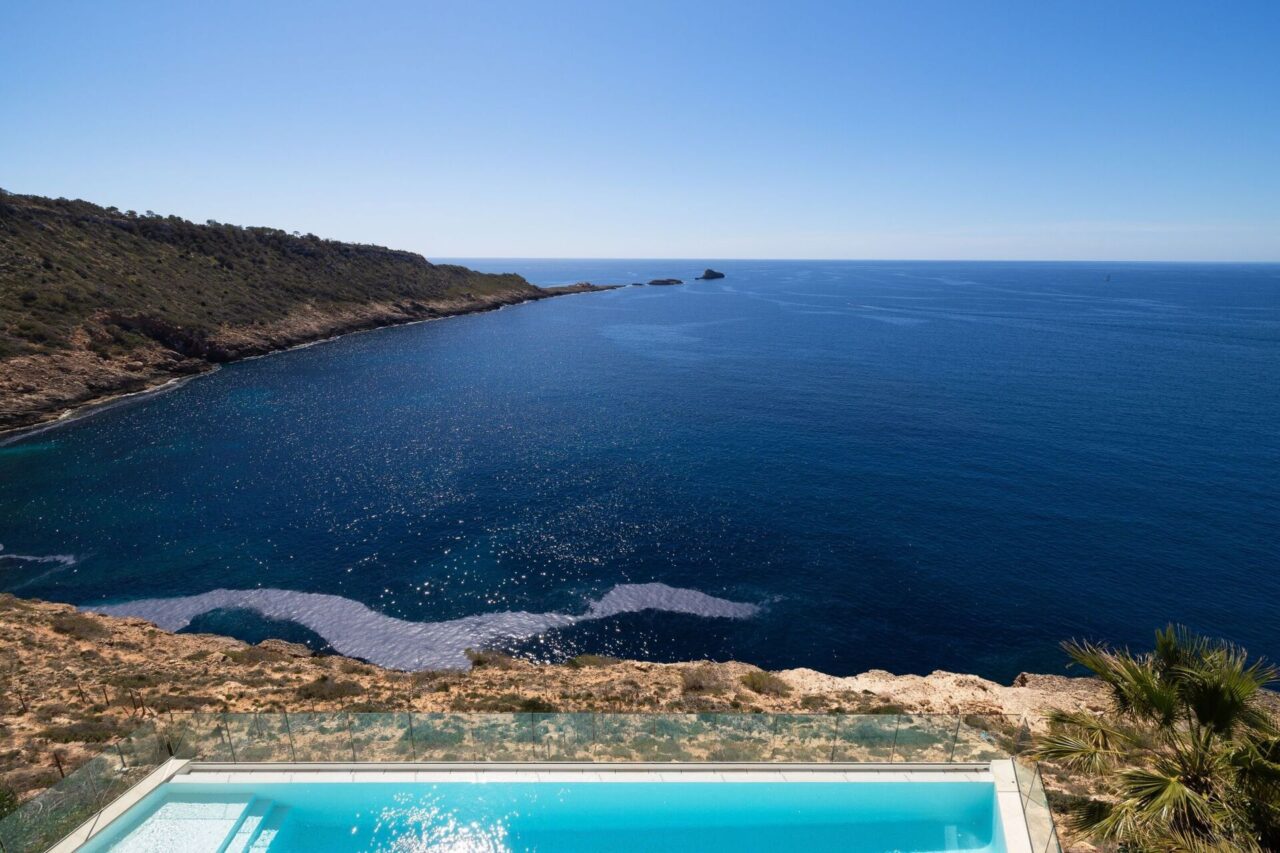 Infinity pool terrace overlooking the Mediterranean coastline
